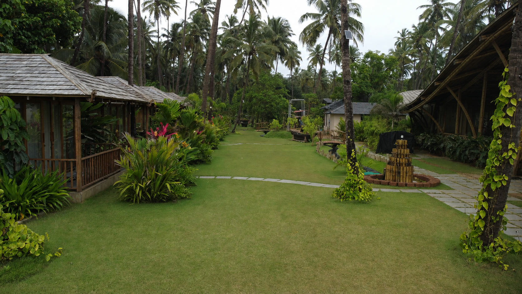 The Wave Goa cottages opening onto a landscaped tropical garden
