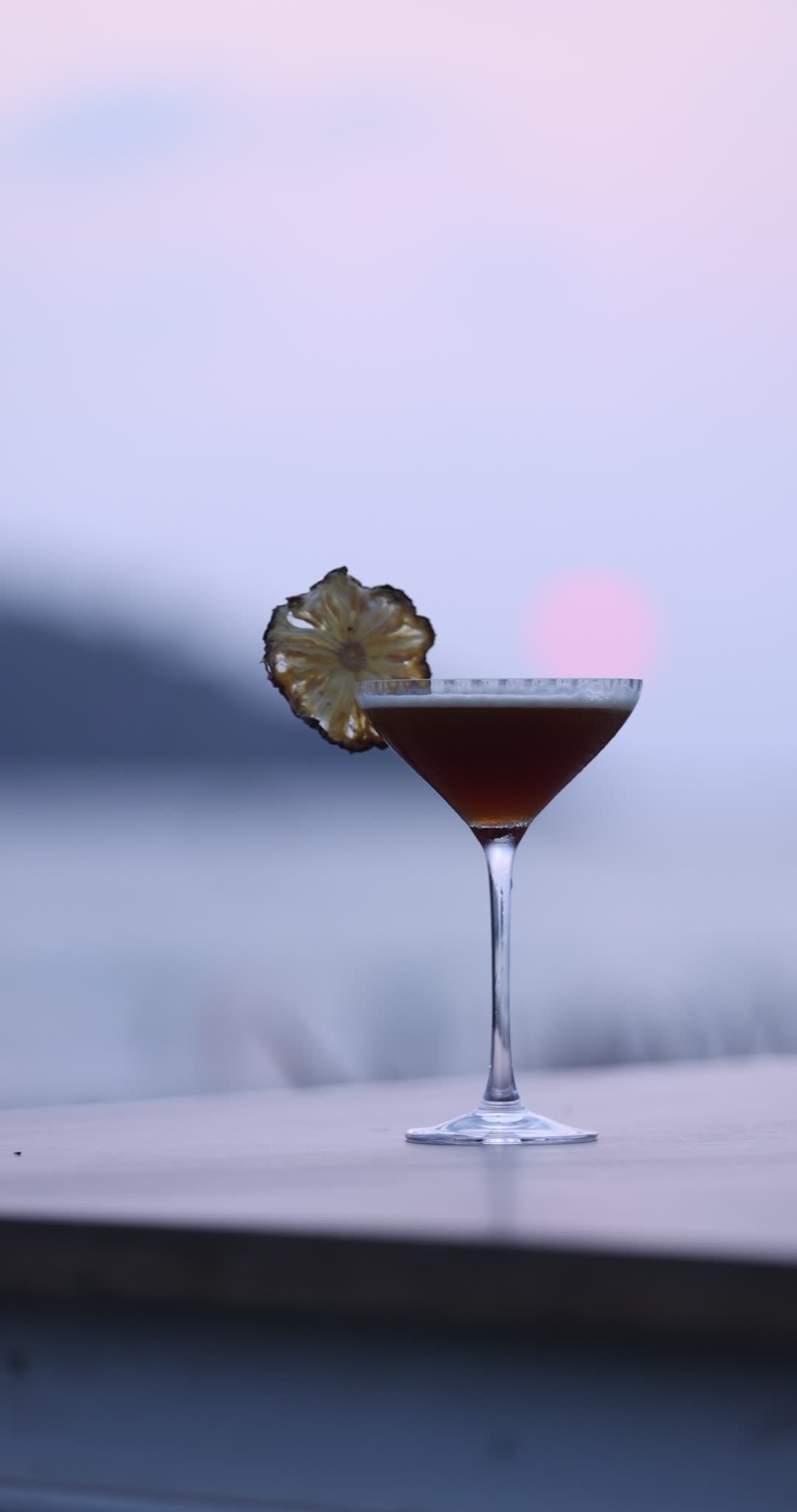 A drink being prepared behind The Wave Goa bar